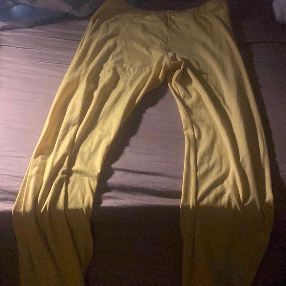 Yellow comfortable leggings flared out on the ankle